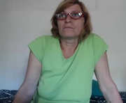 badgg is a 50 year old female webcam sex model.