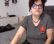 sidnney is a 50 year old female webcam sex model.