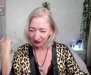 sexy_cat00 is a 57 year old female webcam sex model.