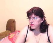 hugetitsxxx is a 48 year old female webcam sex model.