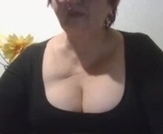 peggysoft is a 60 year old female webcam sex model.