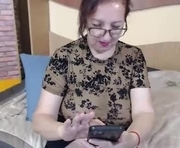 evelynequeen is a 55 year old female webcam sex model.