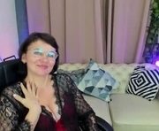 daaamnmature is a 49 year old female webcam sex model.
